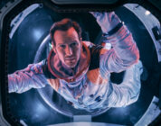 Astronaut Brian Harper (Patrick Wilson) peering into space inside the Space Shuttle in the sci-fi epic MOONFALL