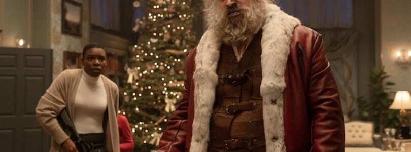 Alexis Louder as Linda and David Harbour as Santa Claus in "Violent Night"