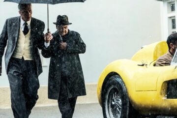 Adam Driver (left) plays Enzo Ferrari preparing for the 1957 Mille Miglia race in "Ferrari."