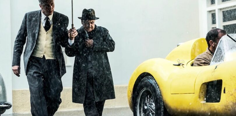 Adam Driver (left) plays Enzo Ferrari preparing for the 1957 Mille Miglia race in "Ferrari."