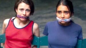 Margaret Qualley and Geraldine Viswanathan in "Drive-Away Dolls."