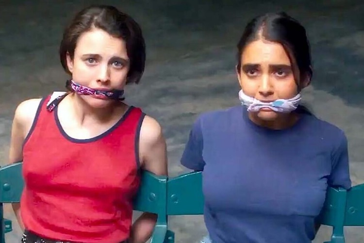 Margaret Qualley and Geraldine Viswanathan in "Drive-Away Dolls."