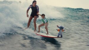 Stitch, Maia Kealoha, Nani, and Sydney Agudong in “Lilo & Stitch.”