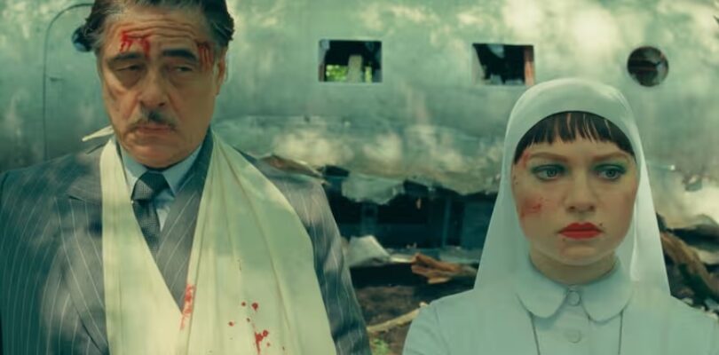 Benicio Del Toro (left) as Zsa-Zsa Korda and Mia Threapleton as Liesl in “The Phoenician Scheme.”