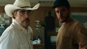 Joaquin Phoenix and Luke Grimes in “Eddington.”
