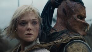 Dimitrius Schuster-Koloamatangi and Elle Fanning in “Predator: Badlands.”